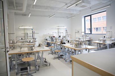 View of Romainville MFA fashion lab with speciality fashion machines.